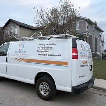Rear of the GBL HVAC LTD van showing 24/7 emergency service and phone number 403-970-6988